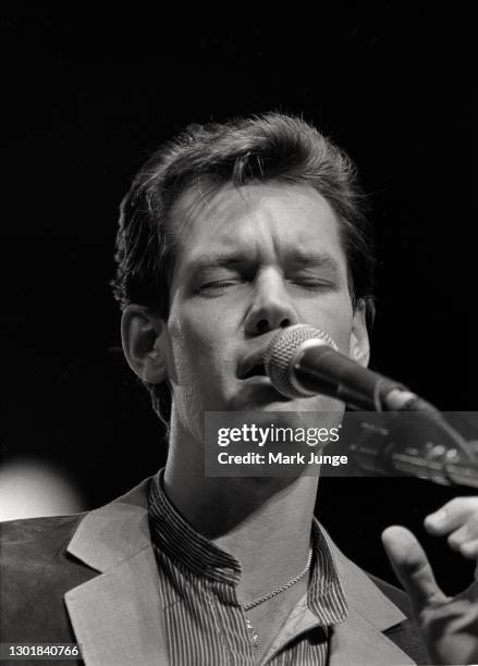 Randy Bruce Traywick, better known as Randy Travis, performs at the Cheyenne Frontier Days rodeo grounds on July, 1987 in Cheyenne, Wyoming. A...