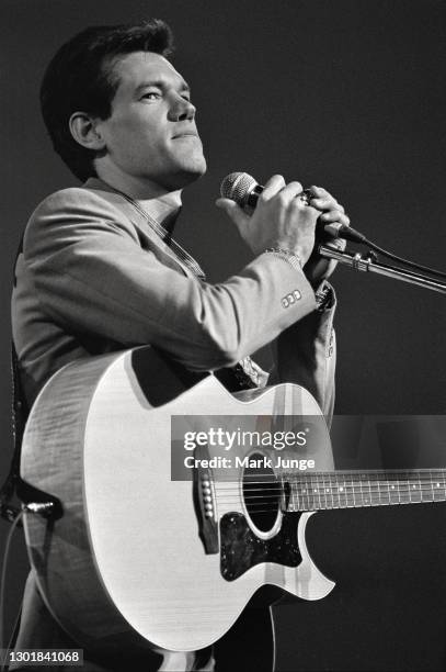 Randy Bruce Traywick, better known as Randy Travis, performs at the Cheyenne Frontier Days rodeo grounds on July, 1987 in Cheyenne, Wyoming. A...