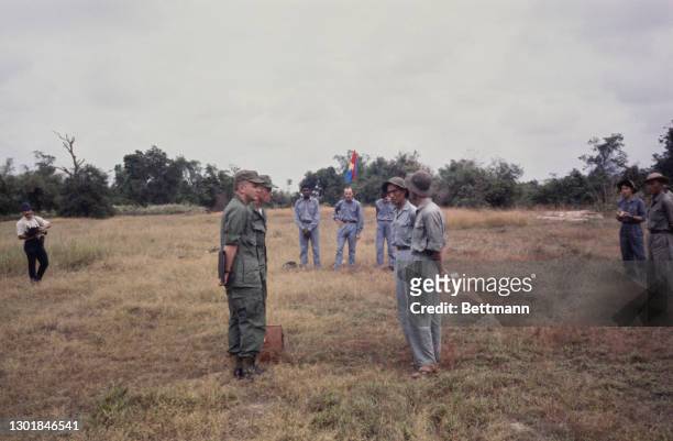 United States prisoners of war James Brigham, Thomas Jones and Donald Smith, each wearing blue trousers and blue shirts, after their release from...