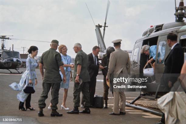 United States First Lady Pat Nixon , wearing a blue-and-white two-piece skirt suit, meeting military personnel during a visit to the 24th Evacuation...