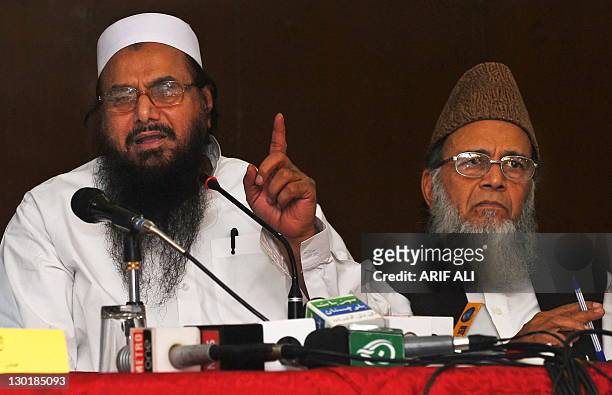 Hafiz Saeed , leader of Jamaat-ud-Dawa and Syed Munawar Hasan, leader of Jamaat-i-Islami, attend the Pakistan Defense conference in Lahore on October...