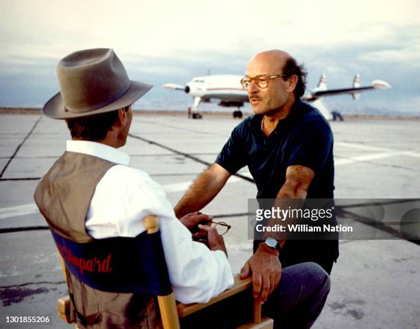 American actor, playwright, author, screenwriter, and director Sam Shepard talks to German filmmaker and director Volker Schlöndorff on the set of...