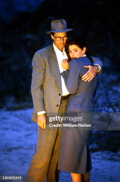 American actor, playwright, author, screenwriter, and director Sam Shepard and American film actress Traci Lind hug during a scene on the set of the...