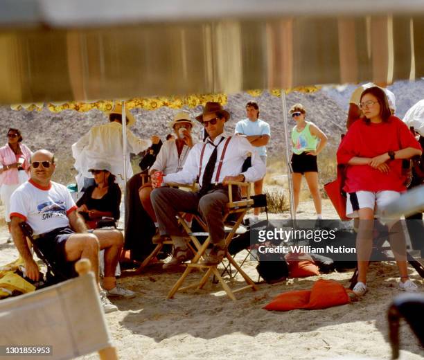 German filmmaker and director Volker Schlöndorff and American actor, playwright, author, screenwriter, and director Sam Shepard sit on the set of the...