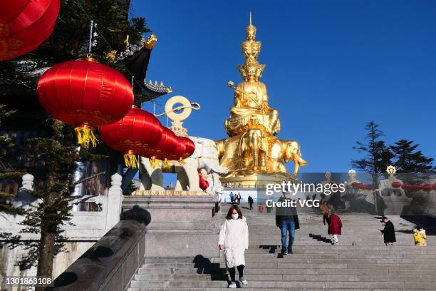 People visit Huazang Temple, or Jinding, on the Mount Emei to celebrate Chinese New Year, the Year of the Ox, on February 12, 2021 in Leshan, Sichuan...