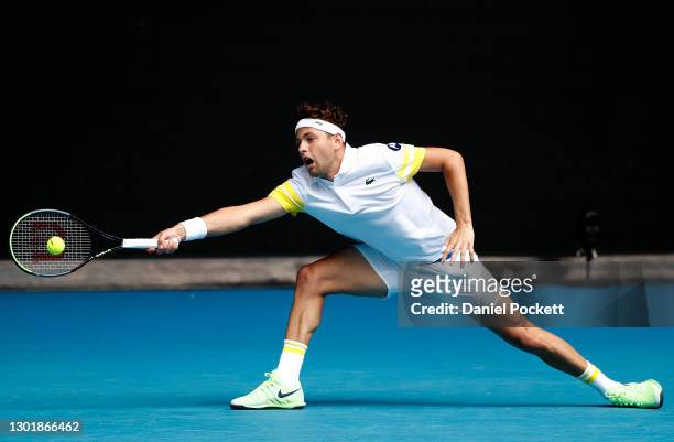 Filip Krajinovic of Serbia plays a forehand in his Men's Singles third round match against Daniil Medvedev of Russia during day six of the 2021...