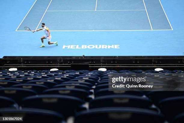 Filip Krajinovic of Serbia plays a backhand in his Men's Singles third round match against Daniil Medvedev of Russia during day six of the 2021...