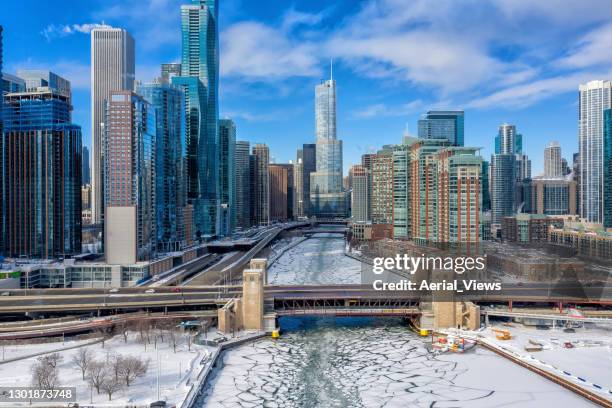 chicago skyline and frozen chicago river - chicago loop stock pictures, royalty-free photos & images