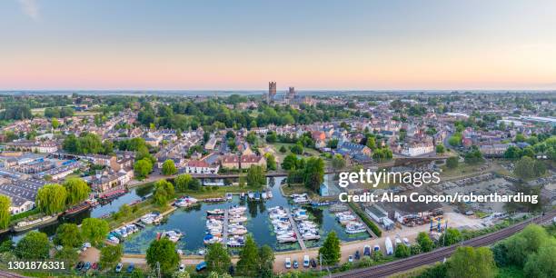 drone view of ely cathedral with ely marina and great ouse river in foreground, ely, cambridgeshire, england, united kingdom, europe - ely ストックフォトと画像