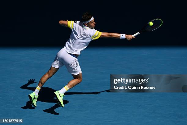 Filip Krajinovic of Serbia plays a backhand in his Men's Singles third round match against Daniil Medvedev of Russia during day six of the 2021...