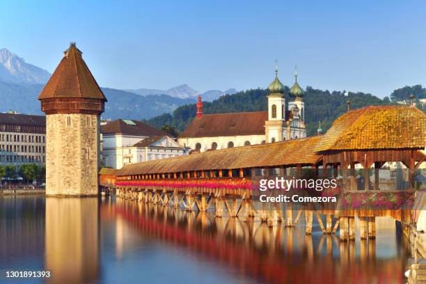 lucerne chapel bridge and old town at sunset sunlight, switzerland - lucerne stock pictures, royalty-free photos & images
