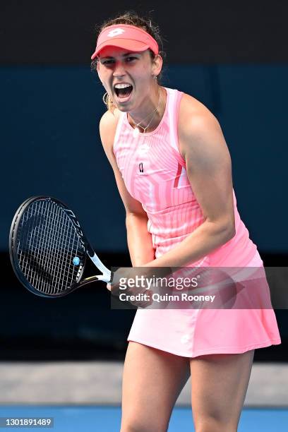Elise Mertens of Belgium celebrates after winning match point in her Women's Singles third round match against Belinda Bencic of Switzerland during...