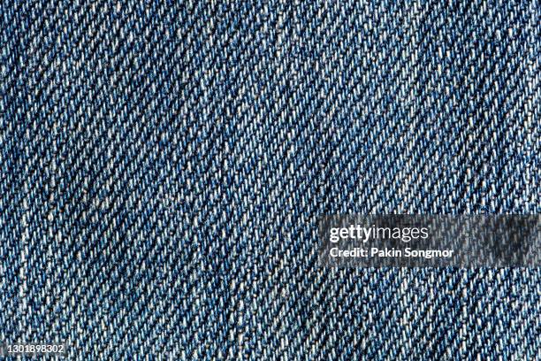 dark blue jeans texture and textile background. - denim stock-fotos und bilder