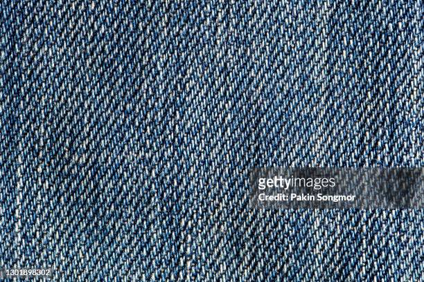 dark blue jeans texture and textile background. - spijkerstof stockfoto's en -beelden