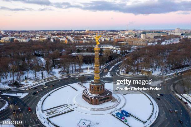 In this aerial view the Victory Column in Tiergarten park stands after a severe snow storm across Germany during the second wave of the coronavirus...