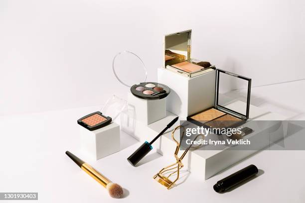 various make-up products on podiums white background. - korean beauty products foto e immagini stock