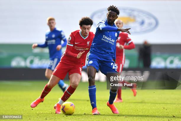 Wilfred Ndidi of Leicester City is challenged by Curtis Jones of Liverpool during the Premier League match between Leicester City and Liverpool at...