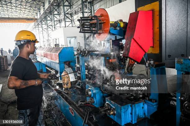 steel tubes welding in a factory. - making stock pictures, royalty-free photos & images