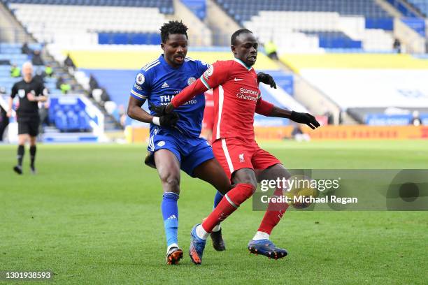 Sadio Mane of Liverpool is challenged by Daniel Amartey of Leicester City during the Premier League match between Leicester City and Liverpool at The...