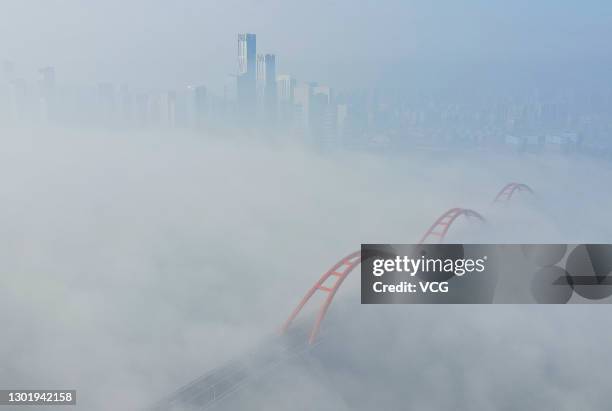 Aerial view of buildings surrounded by dense fog in the morning on February 13, 2021 in Changsha, Hunan Province of China.