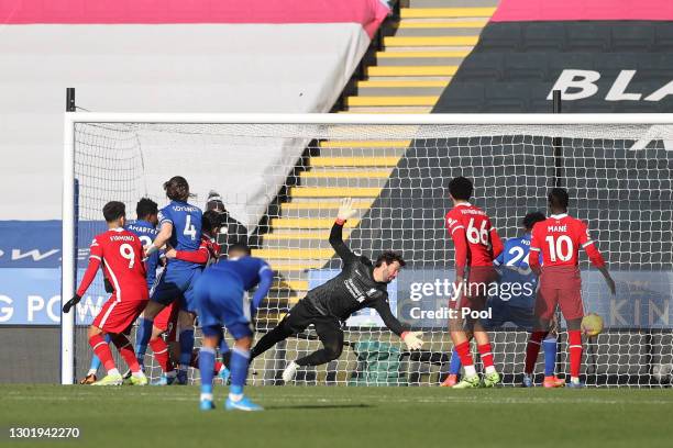 Alisson of Liverpool fails To save as James Maddison of Leicester City scores his team's first goal during the Premier League match between Leicester...