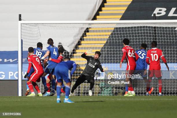 Alisson of Liverpool fails To save as James Maddison of Leicester City score his team's first goal during the Premier League match between Leicester...