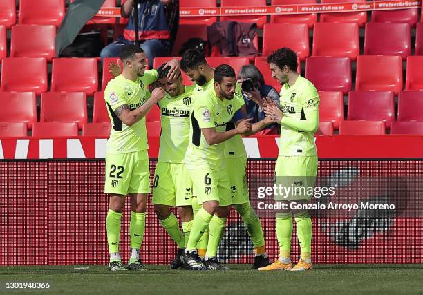 Angel Correa of Atletico de Madrid celebrates with teammate Mario Hermoso after scoring his team's second goal during the La Liga Santander match...