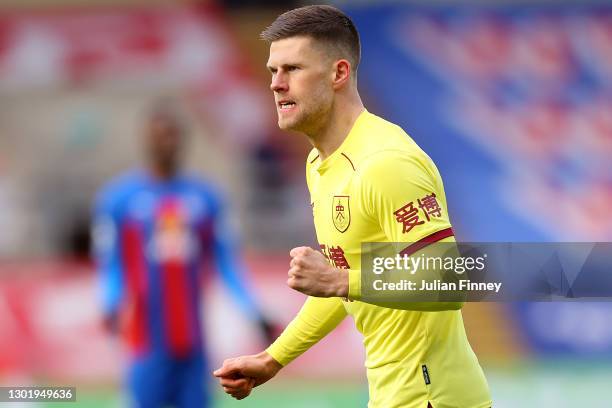 Johann Gudmundsson of Burnley celebrates after scoring his team's first goal during the Premier League match between Crystal Palace and Burnley at...