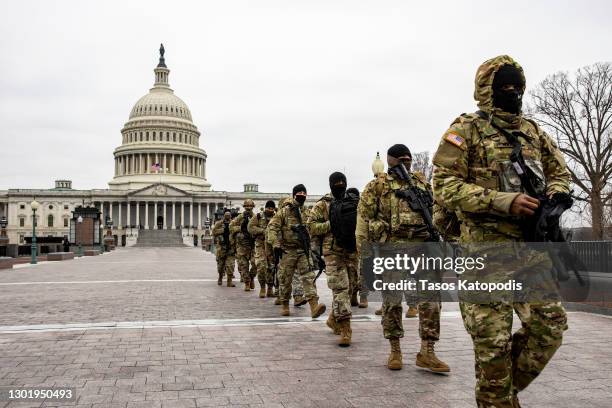 National Gaurd members patrol the US Capitol on February 13, 2021 in Washington, DC. House impeachment managers will make the case that Trump was...