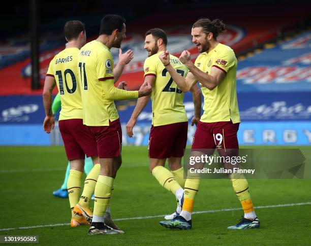 Jay Rodriguez of Burnley celebrates with teammate Dwight McNeil after scoring his team's second goal during the Premier League match between Crystal...