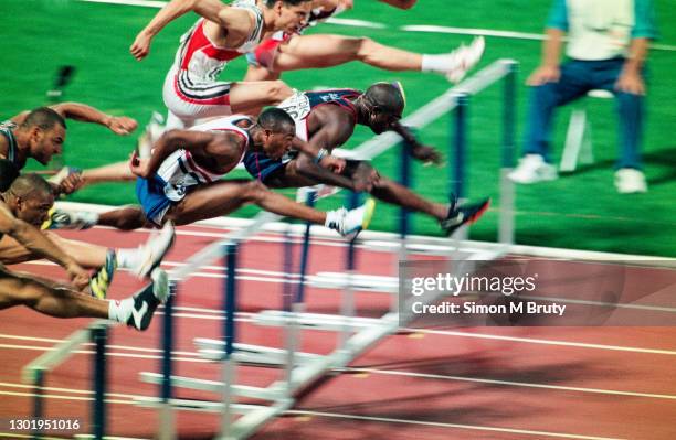 Allen Johnson of the United States of America winning the Men's 110m hurdle final followed by Colin Jackson of Great Britain and Florian Schwarthoff...