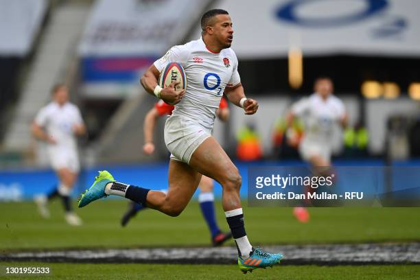 Anthony Watson of England breaks away after intercepting to go on and score their side's fourth try during the Guinness Six Nations match between...