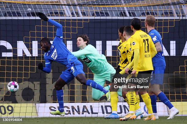 Ihlas Bebou of TSG 1899 Hoffenheim scores his team's second goal past Marwin Hitz of Borussia Dortmund during the Bundesliga match between Borussia...