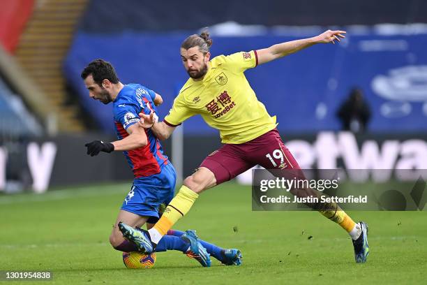Luka Milivojevic of Crystal Palace is challenged by Jay Rodriguez of Burnley during the Premier League match between Crystal Palace and Burnley at...