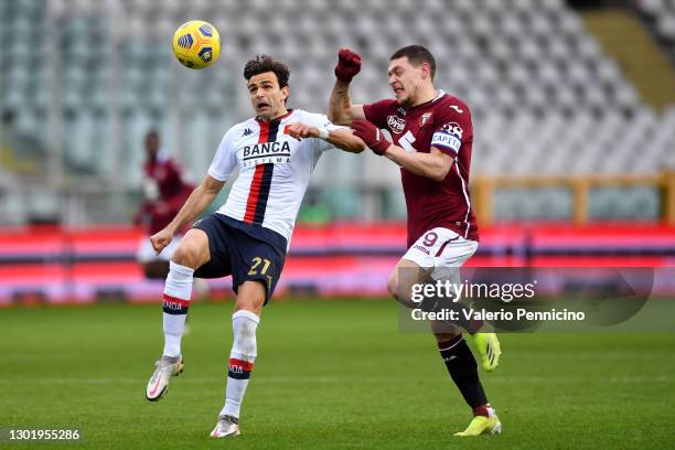 Ivan Radovanovic of Genoa C.F.C. Is challenged by Andrea Belotti of Torino FC during the Serie A match between Torino FC and Genoa CFC at Stadio...