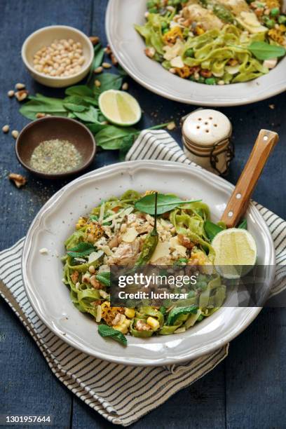 leftover chicken breast green pasta with basil-mint pesto - pesto sauce stock pictures, royalty-free photos & images