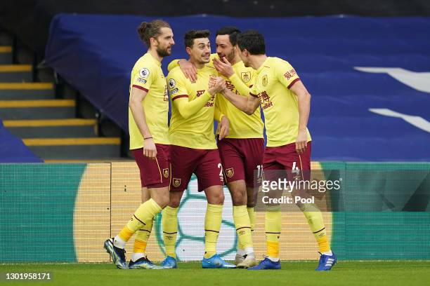 Matthew Lowton of Burnley celebrates with teammates after scoring his team's third goal during the Premier League match between Crystal Palace and...