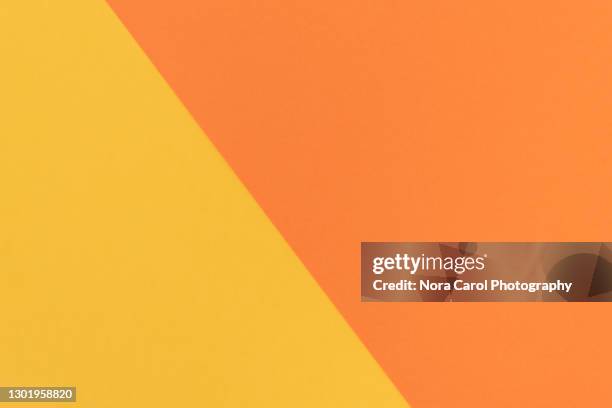 color block background orange and yellow color - colour block stock pictures, royalty-free photos & images