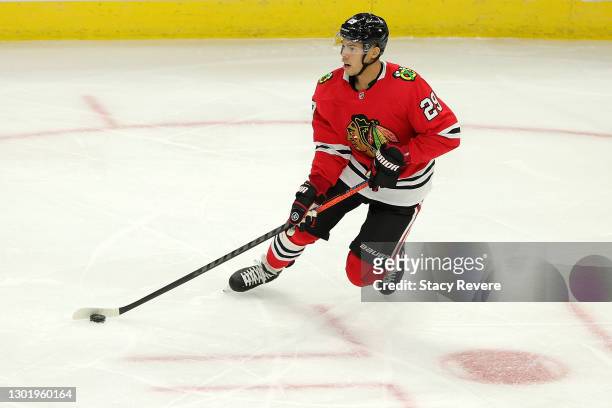 Madison Bowey of the Chicago Blackhawks controls the puck during a game against the Columbus Blue Jackets at the United Center on February 11, 2021...