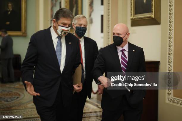 Sen. Joe Manchin , Sen. Angus King and Sen. Mark Kelly head to the Senate Chamber for the fifth day of former President Donald Trump's impeachment...