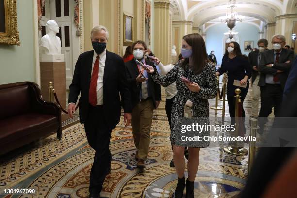 Sen. Angus King is pursued by reporters outside the Senate Chamber for the fifth day of former President Donald Trump's impeachment trial at the U.S....