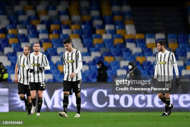 Alvaro Morata of Juventus looks dejected with team mates Adrien Rabiot and Rodrigo Bentancur after Napoli's first goal scored by Lorenzo Insigne from...