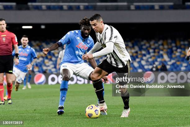 Cristiano Ronaldo of Juventus is challenged by Tiemoue Bakayoko of SSC Napoli during the Serie A match between SSC Napoli and Juventus at Stadio...
