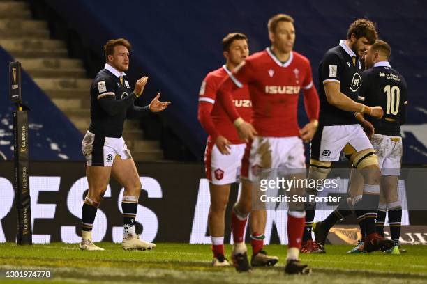 Stuart Hogg of Scotland celebrates touching down for his team's third try during the Guinness Six Nations match between Scotland and Wales at...