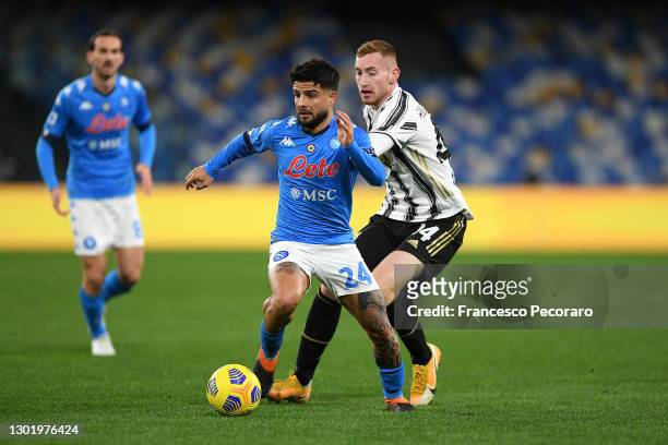 Lorenzo Insigne of Napoli is challenged by Dejan Kulusevski of Juventus during the Serie A match between SSC Napoli and Juventus at Stadio Diego...