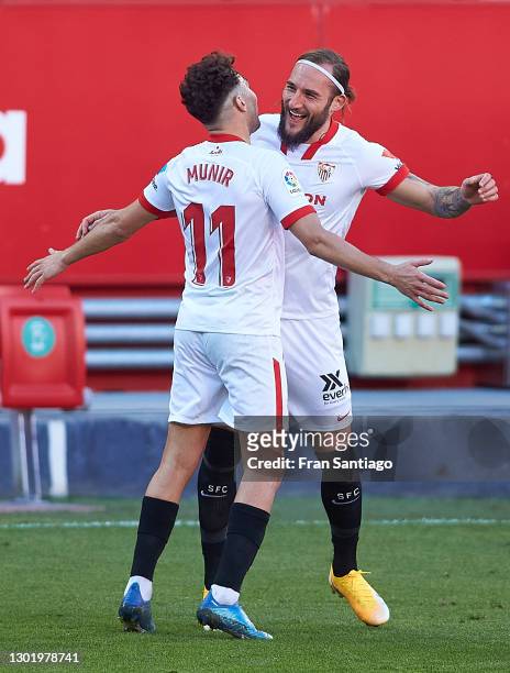 Munir El Haddadi of Sevilla FC celebrates scoring a goal with Nemanja Gudelj during the La Liga Santander match between Sevilla FC and SD Huesca at...