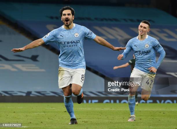 Ilkay Gundogan of Manchester City celebrates after scoring their side's third goal during the Premier League match between Manchester City and...