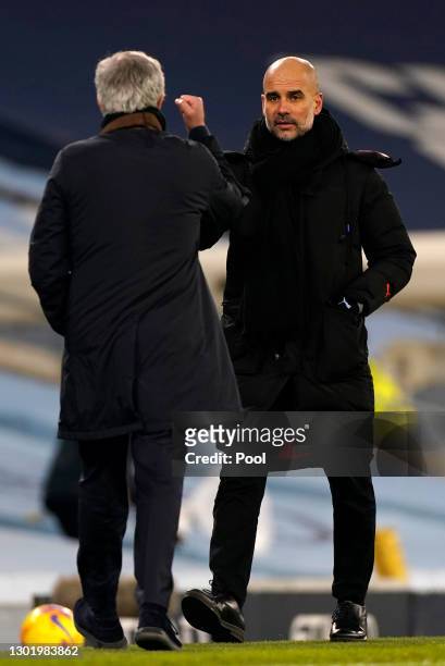 Jose Mourinho, Manager of Tottenham Hotspur shakes hands with Pep Guardiola, Manager of Manchester City following the Premier League match between...