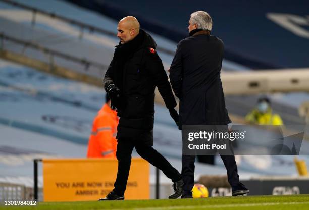 Jose Mourinho, Manager of Tottenham Hotspur shakes hands with Pep Guardiola, Manager of Manchester City following the Premier League match between...