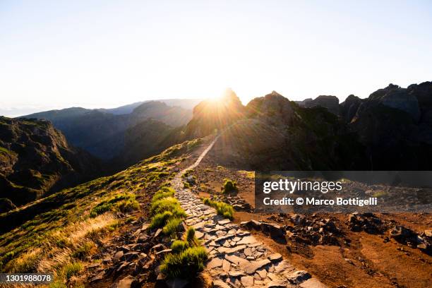 mountain ridge footpath at sunset - narrow stock pictures, royalty-free photos & images